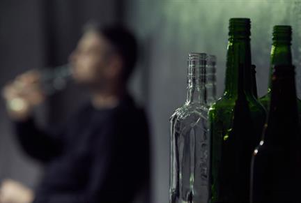 Bottles with man in background