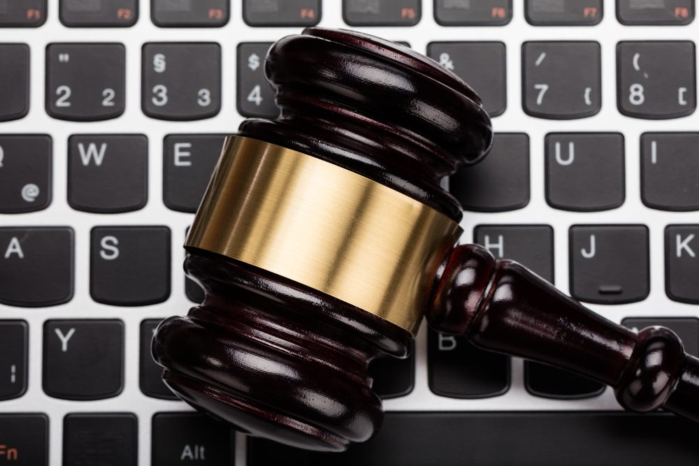 A gavel resting on a computer keyboard