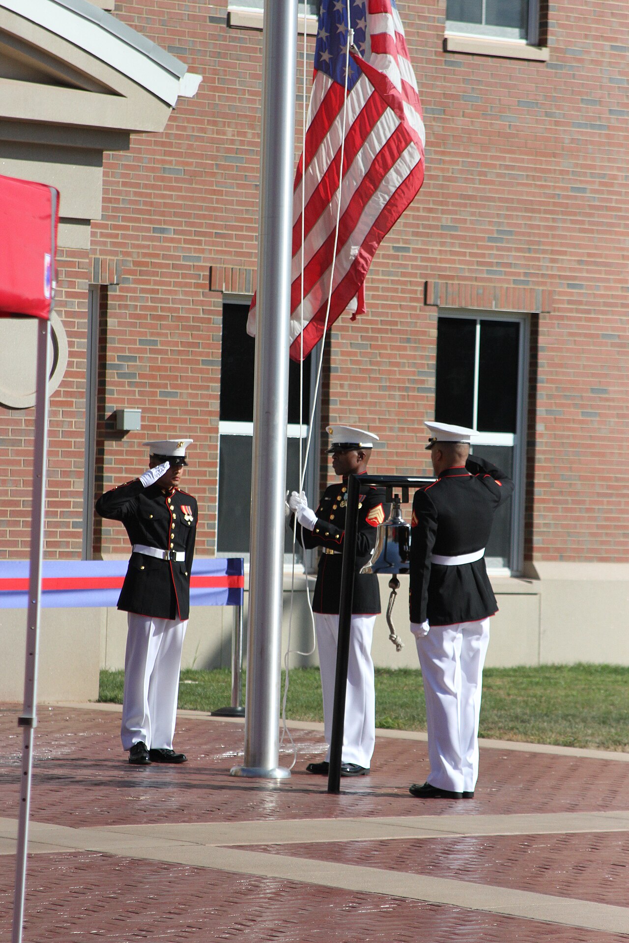 A flag raising at the Marine Corps Embassy Security Group headquarters opening (2016).