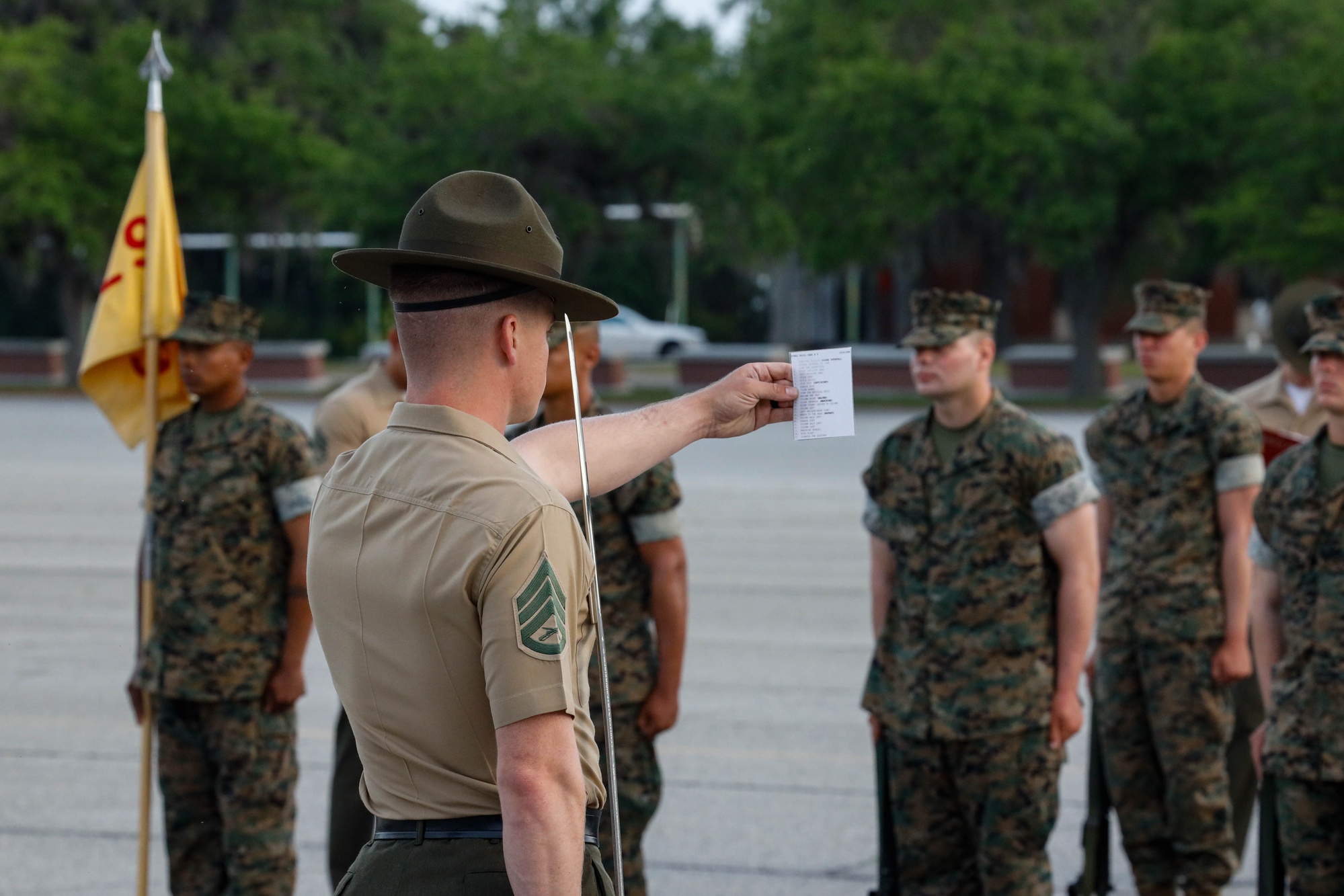 A Marine drill instructor leading final drill at Parris Island (2025).