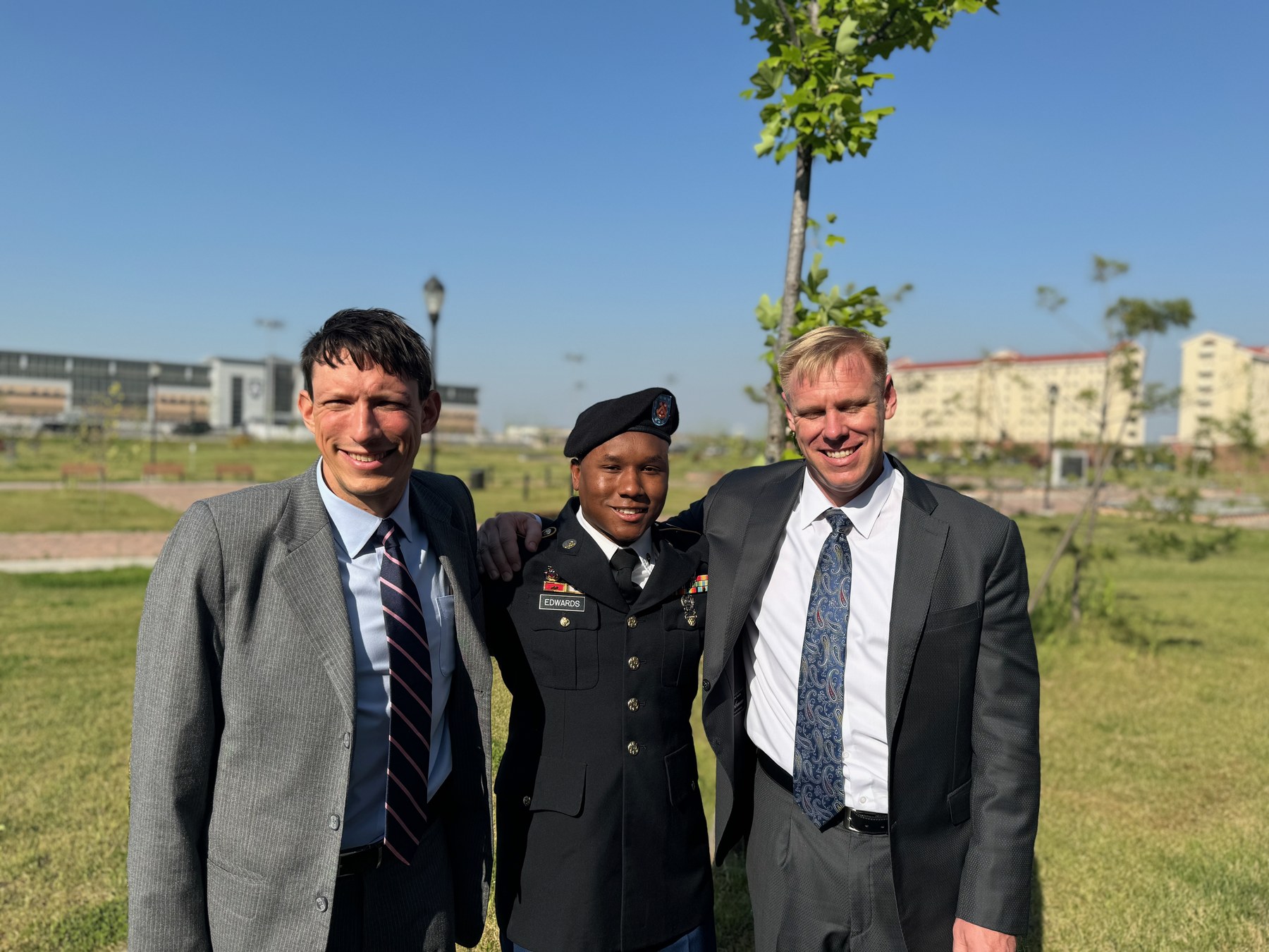 Tim Bilecki and Ben Gold standing with a client in Korea.