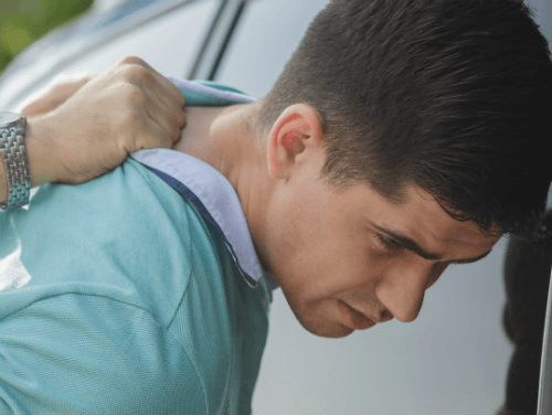 man getting arrested with head on car