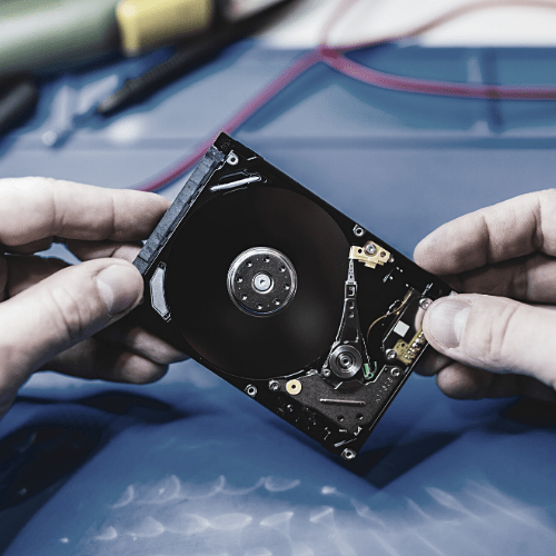 A computer forensic technician examining a computer
