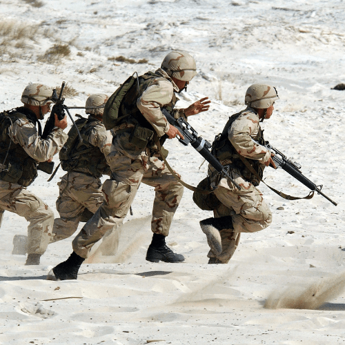 Soldiers running on a battlefield