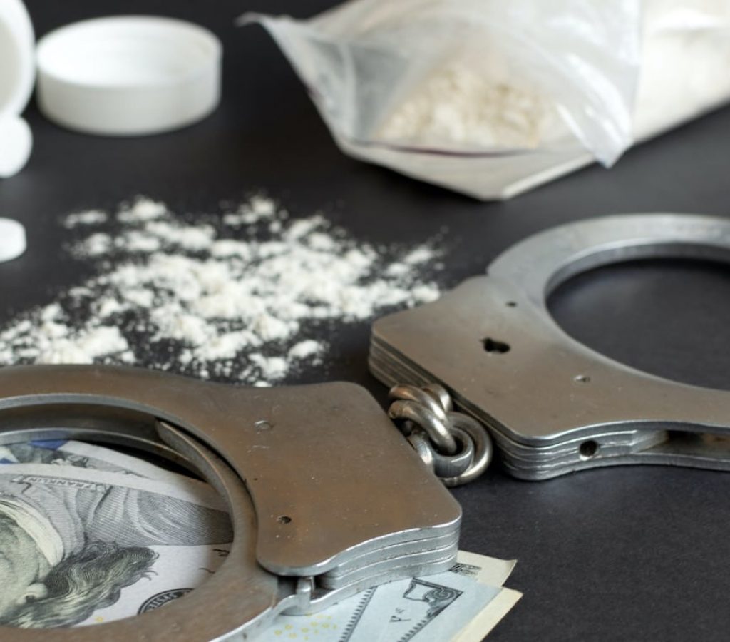 Drugs-and-handcuffs-sized Drugs-and-handcuffs-sized