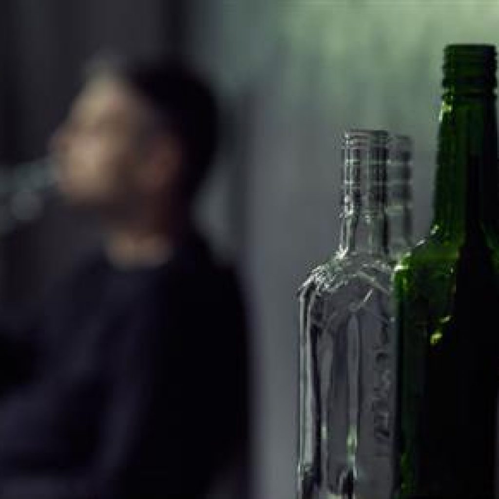 bottles and soldier Bottles with man in background